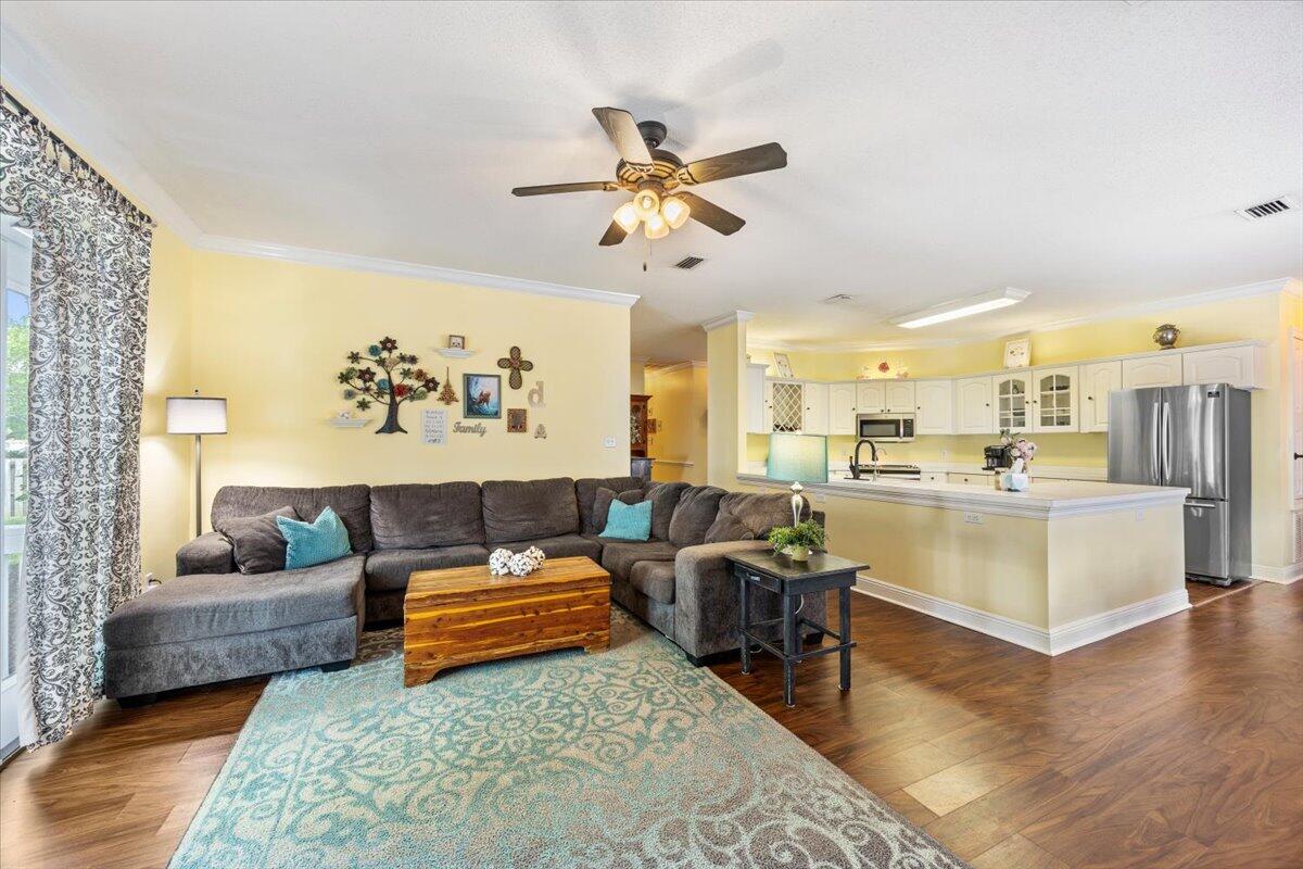 1830 Seahawk Lane Navarre, FL 32566 - Photo 14 of 53 a living room with furniture and a view of kitchen