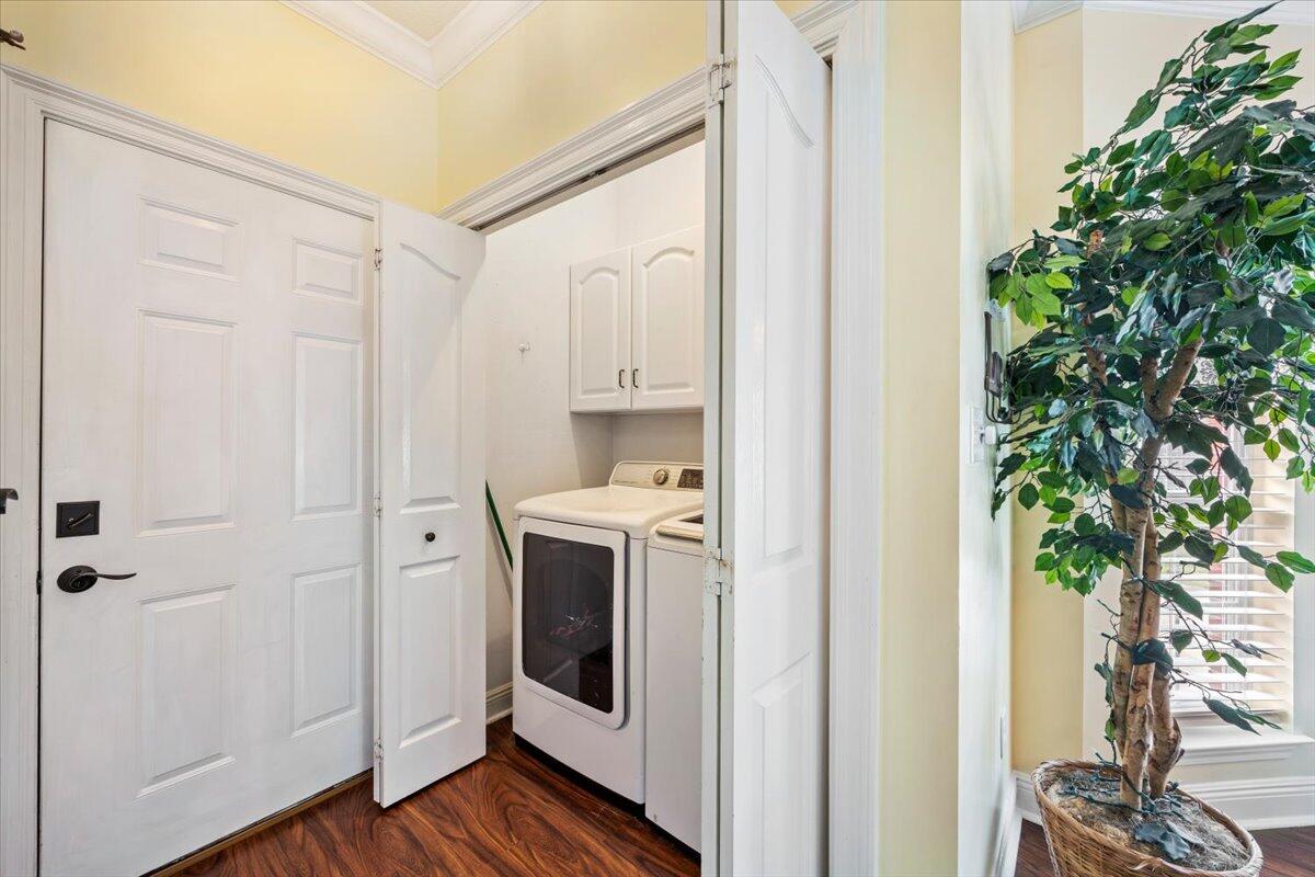1830 Seahawk Lane Navarre, FL 32566 - Photo 18 of 53 a view of a hallway with washer and dryer