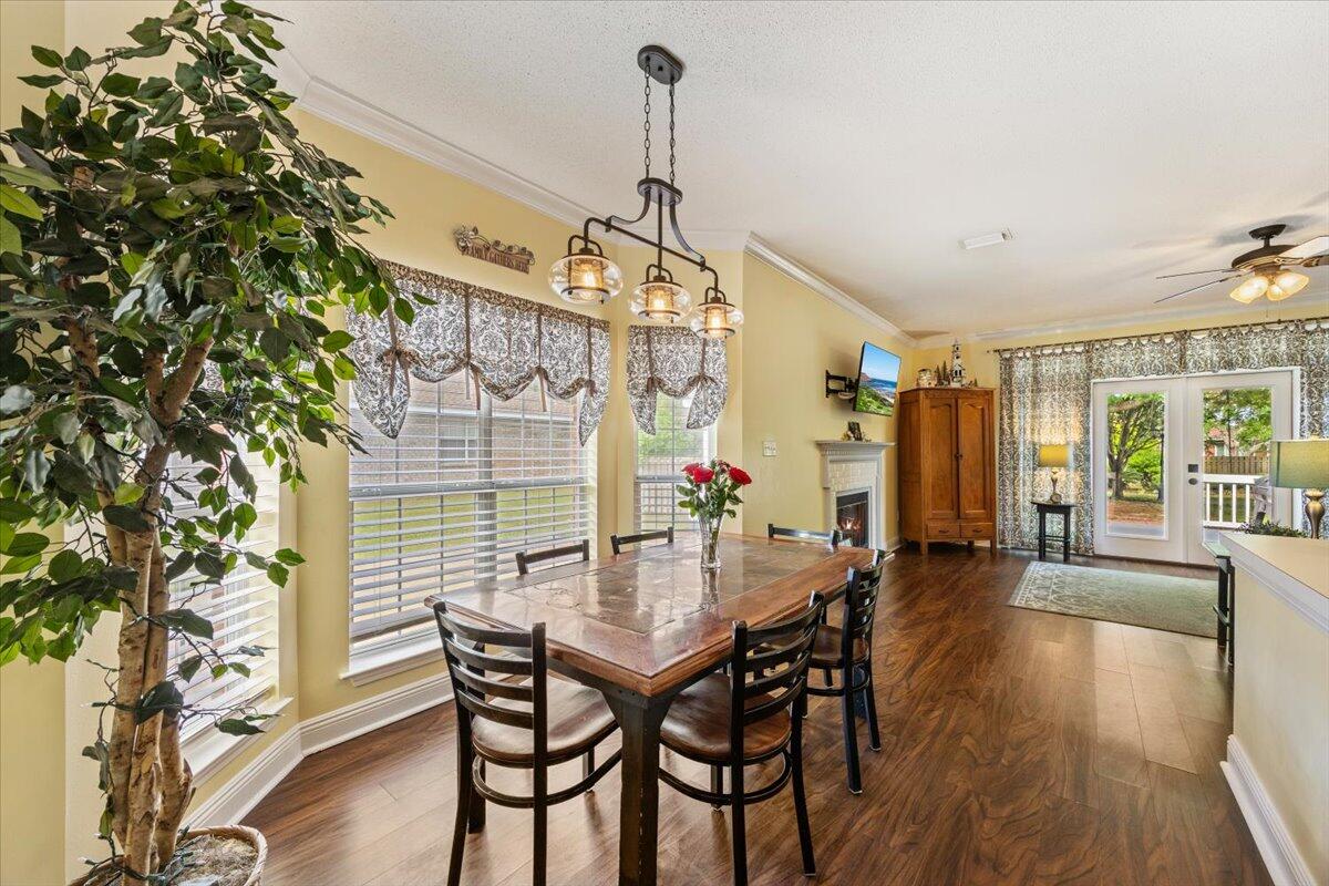 1830 Seahawk Lane Navarre, FL 32566 - Photo 19 of 53 a dining room with furniture and wooden floor