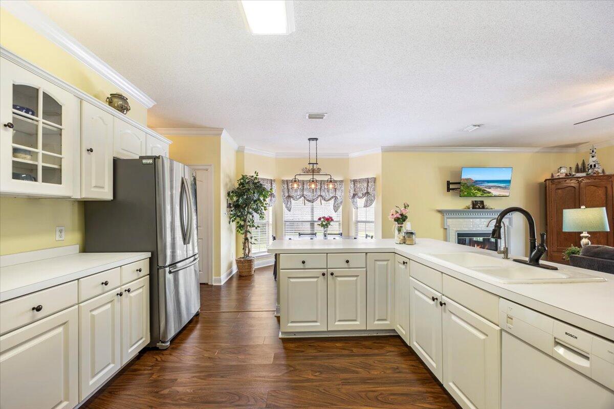 1830 Seahawk Lane Navarre, FL 32566 - Photo 20 of 53 a kitchen with white cabinets and sink