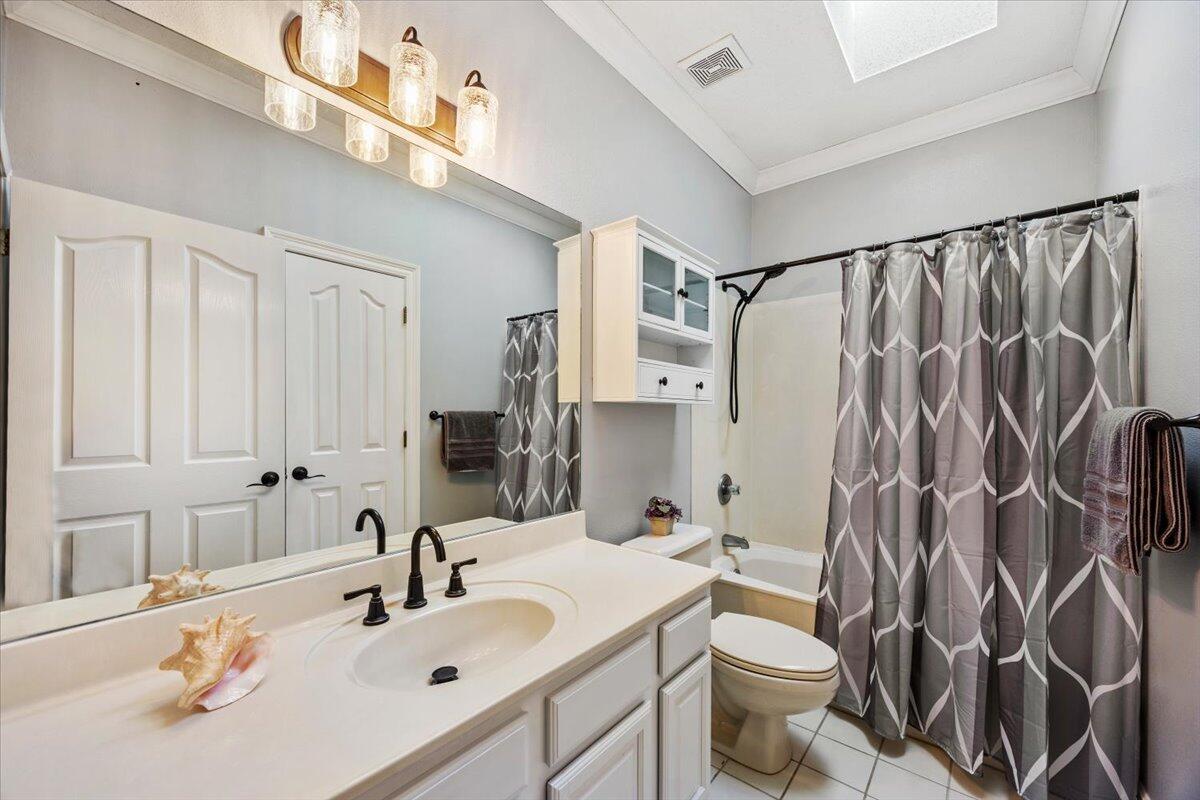 1830 Seahawk Lane Navarre, FL 32566 - Photo 24 of 53 a bathroom with a sink and a mirror