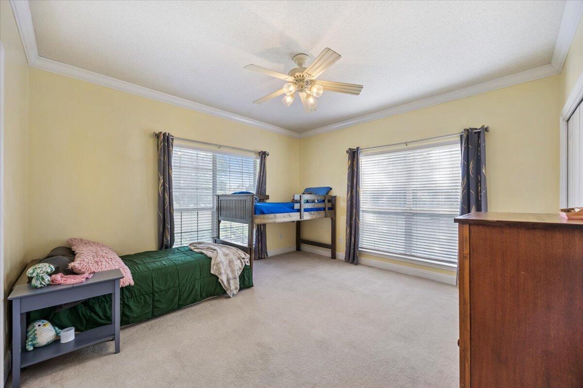 1830 Seahawk Lane Navarre, FL 32566 - Photo 25 of 53 a bedroom with furniture and a window