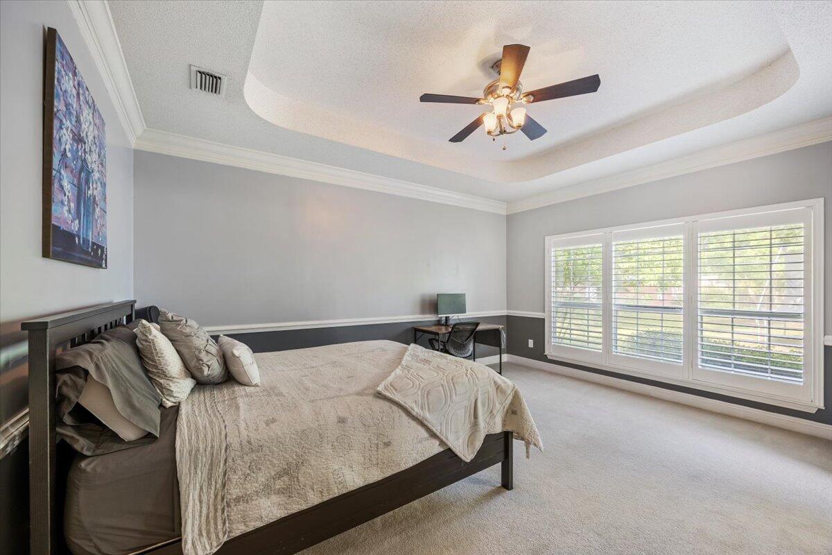 1830 Seahawk Lane Navarre, FL 32566 - Photo 28 of 53 a bed sitting in a bedroom next to a window