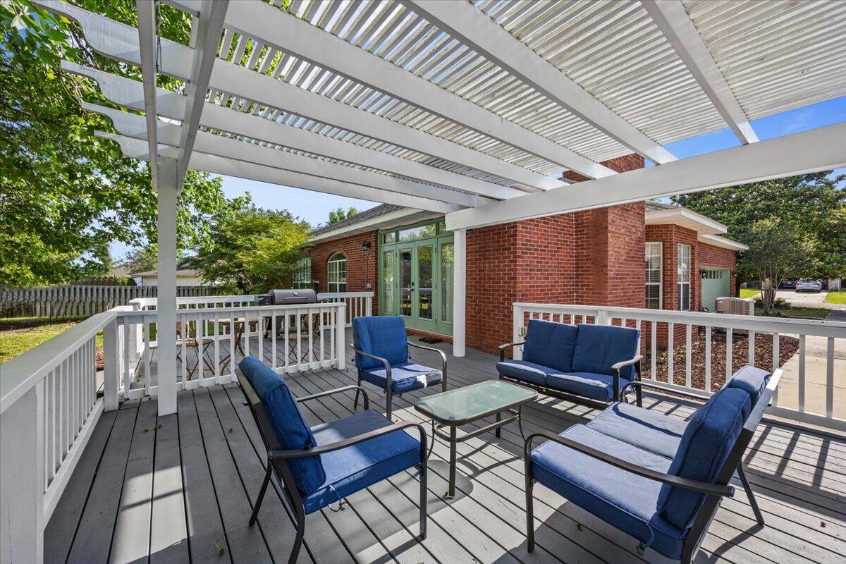 1830 Seahawk Lane Navarre, FL 32566 - Photo 35 of 53 a view of a chair and tables in the balcony