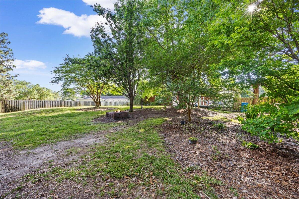 1830 Seahawk Lane Navarre, FL 32566 - Photo 38 of 53 a view of outdoor space with deck and yard