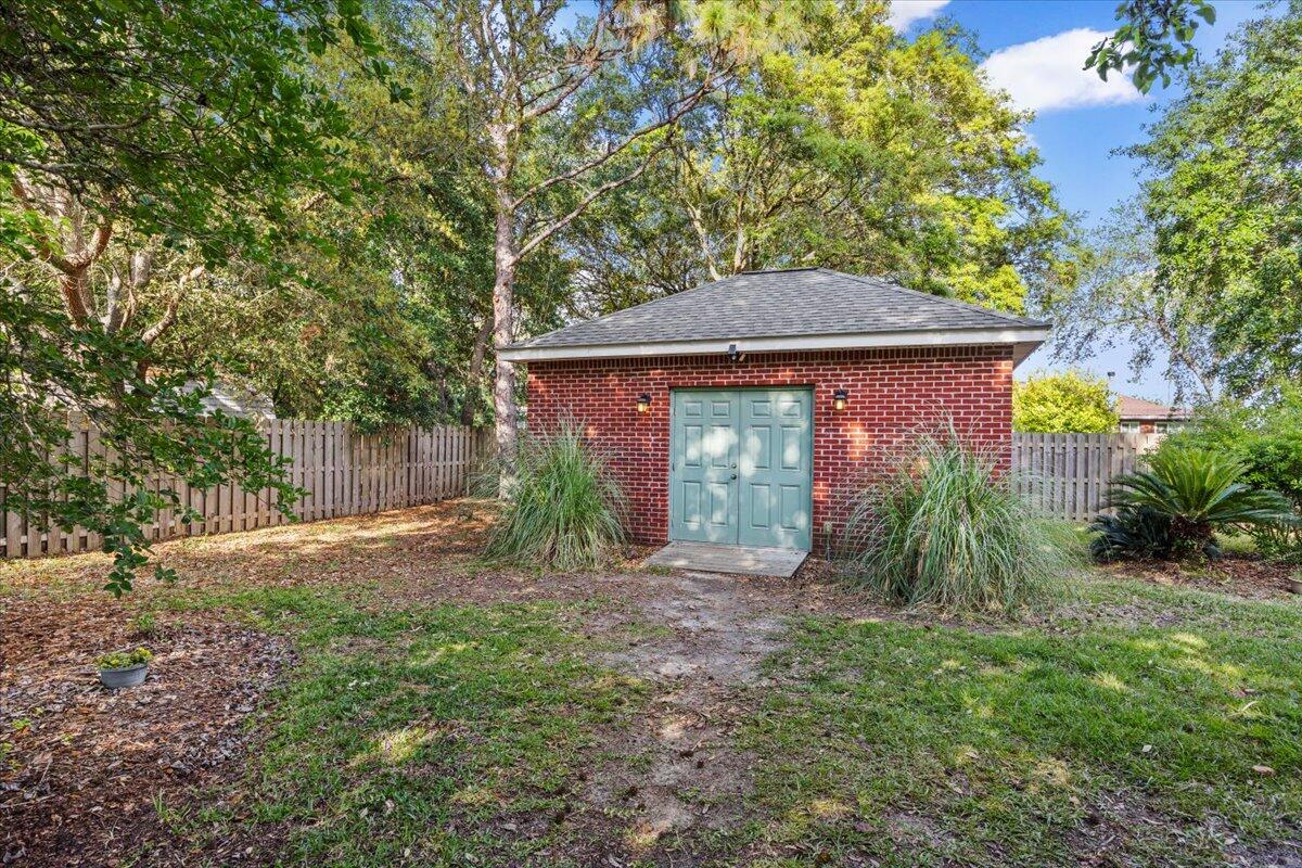 1830 Seahawk Lane Navarre, FL 32566 - Photo 39 of 53 a front view of a house with garden