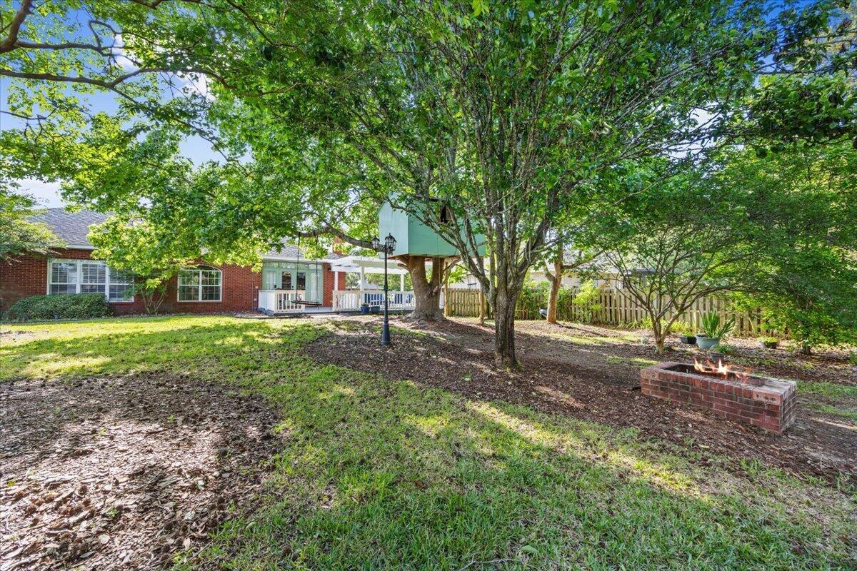 1830 Seahawk Lane Navarre, FL 32566 - Photo 45 of 53 a view of a yard with plants and trees