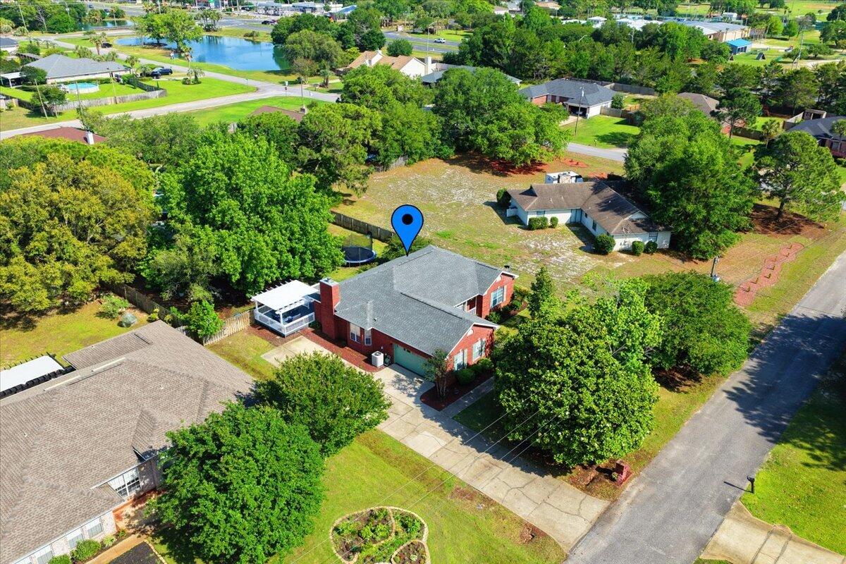 1830 Seahawk Lane Navarre, FL 32566 - Photo 49 of 53 an aerial view of a house with a garden