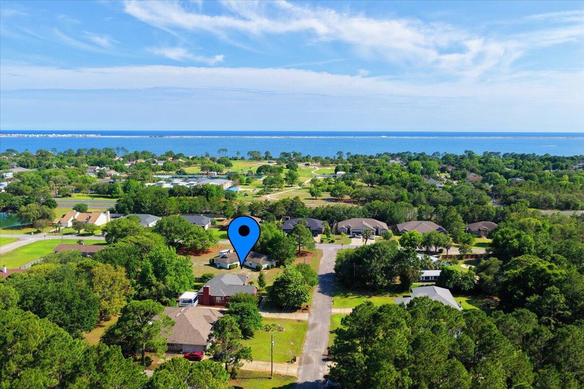 1830 Seahawk Lane Navarre, FL 32566 - Photo 50 of 53 a view of a bunch of flowers and trees