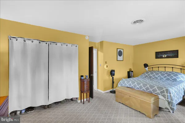 a bedroom with a bed and a table