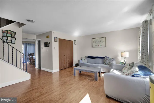 a living room with furniture and a table
