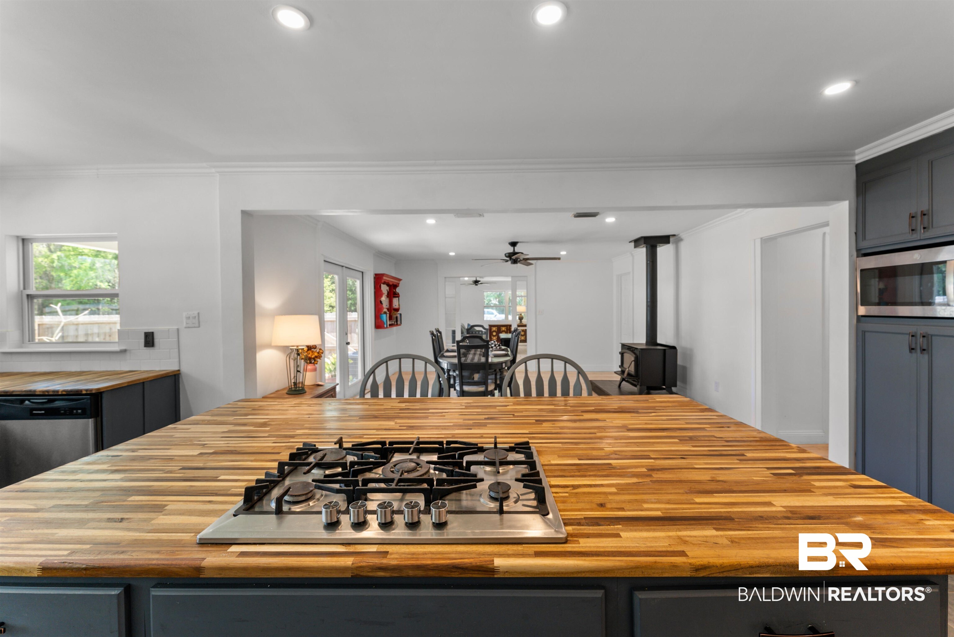 6447 Bemis Lane Bon Secour, AL 36511 - Photo 13 of 62 Kitchen island featuring a built-in gas cooktop and wood-finish countertop