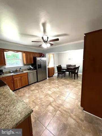 a room with stainless steel appliances lots of counter top space