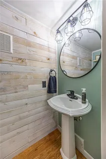 a bathroom with a sink and mirror