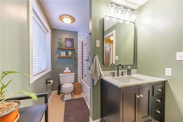 a bathroom with a sink vanity and a mirror