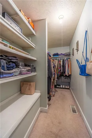 a bedroom with furniture and a ceiling fan