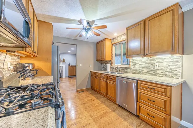 a spacious bathroom with a granite countertop sink and a mirror