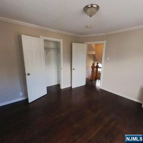 167 James Street Hackensack, NJ 07601 - Photo 19 of 30 a view of an empty room with wooden floor and a cabinet