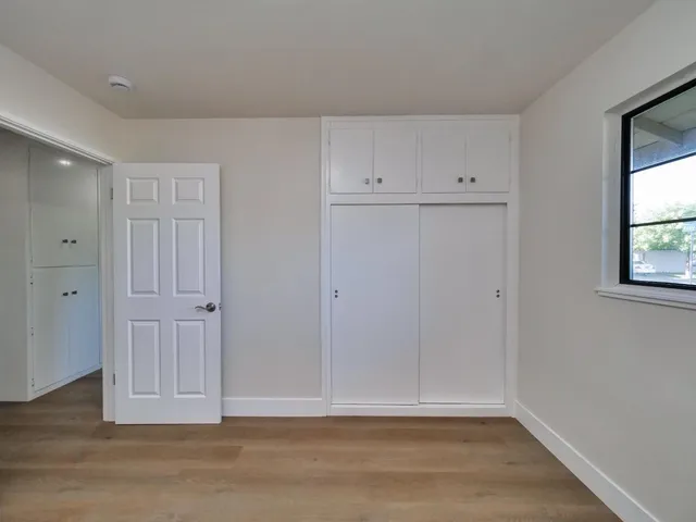 a view of room with hardwood floor