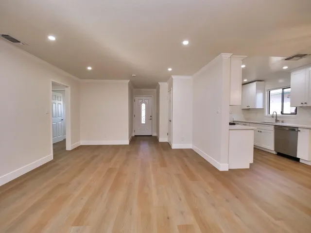 a view of kitchen with wooden floor