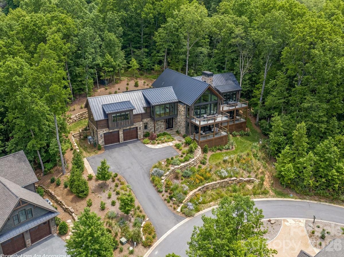 11 Crockett Ridge Road Black Mountain, NC 28711 - Photo 1 of 19 an aerial view of a house with swimming pool garden and patio