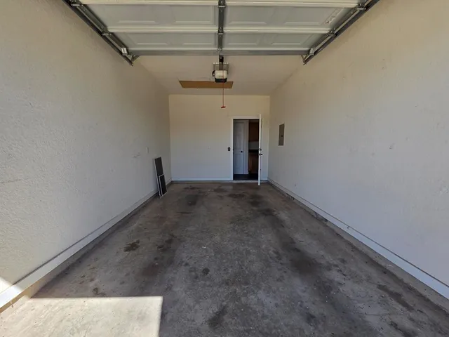 a view of a hallway with a chandelier