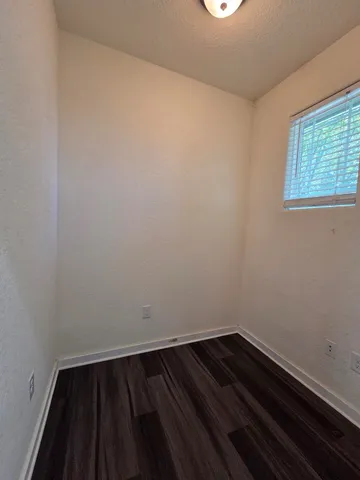 a view of wooden floor in an empty room