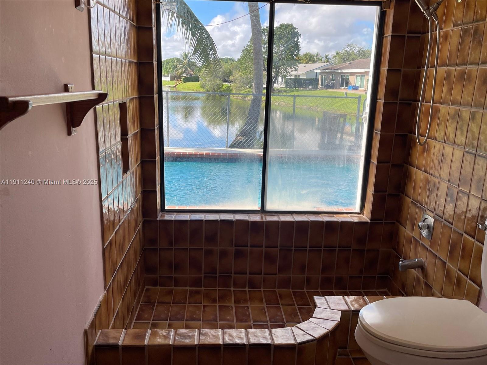 14604 Southwest 60th Terrace Miami, FL 33183 - Photo 13 of 55 a bathroom with a toilet and a shower