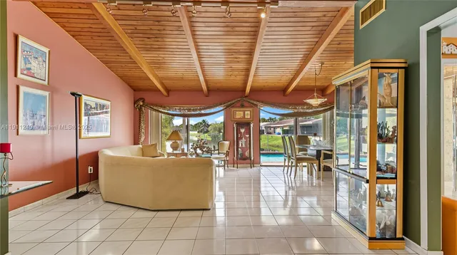 a kitchen with a sink and white cabinets