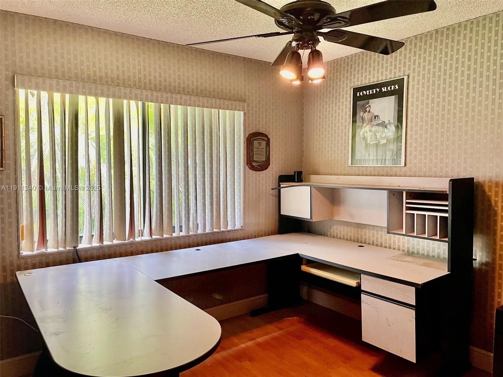 14604 Southwest 60th Terrace Miami, FL 33183 - Photo 20 of 55 a kitchen with a table chairs and a window