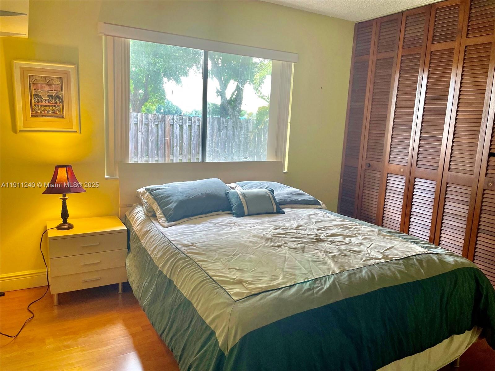 14604 Southwest 60th Terrace Miami, FL 33183 - Photo 22 of 55 a bedroom with a bed dresser and a window