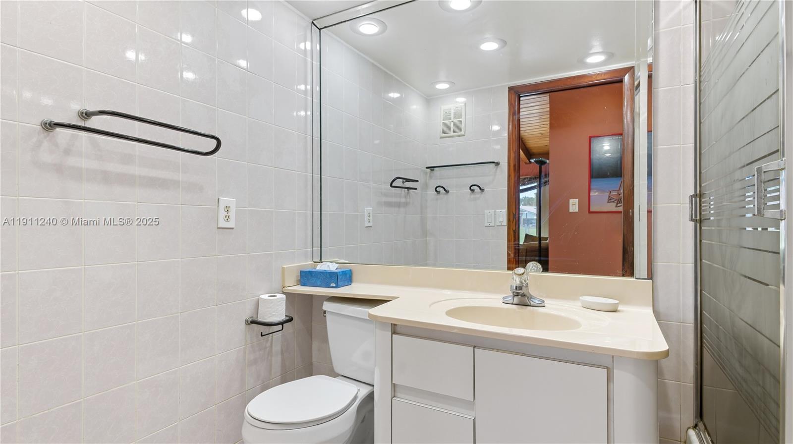 14604 Southwest 60th Terrace Miami, FL 33183 - Photo 23 of 55 a bathroom with a sink toilet and shower