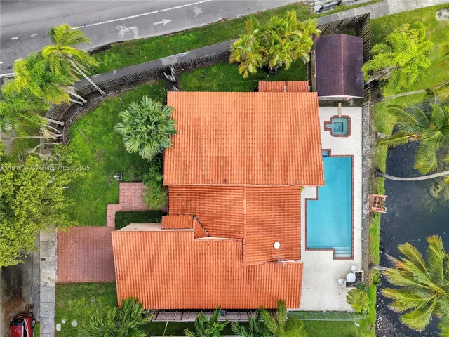 a view of a swimming pool with a table and chairs