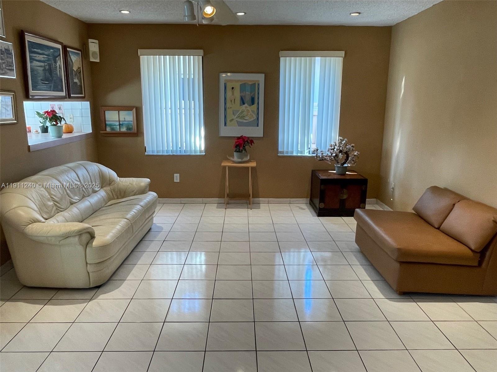 14604 Southwest 60th Terrace Miami, FL 33183 - Photo 37 of 55 a living room with furniture and a window