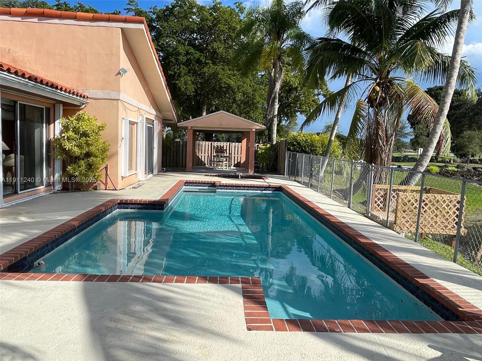 14604 Southwest 60th Terrace Miami, FL 33183 - Photo 38 of 55 a view of a house with backyard and sitting area
