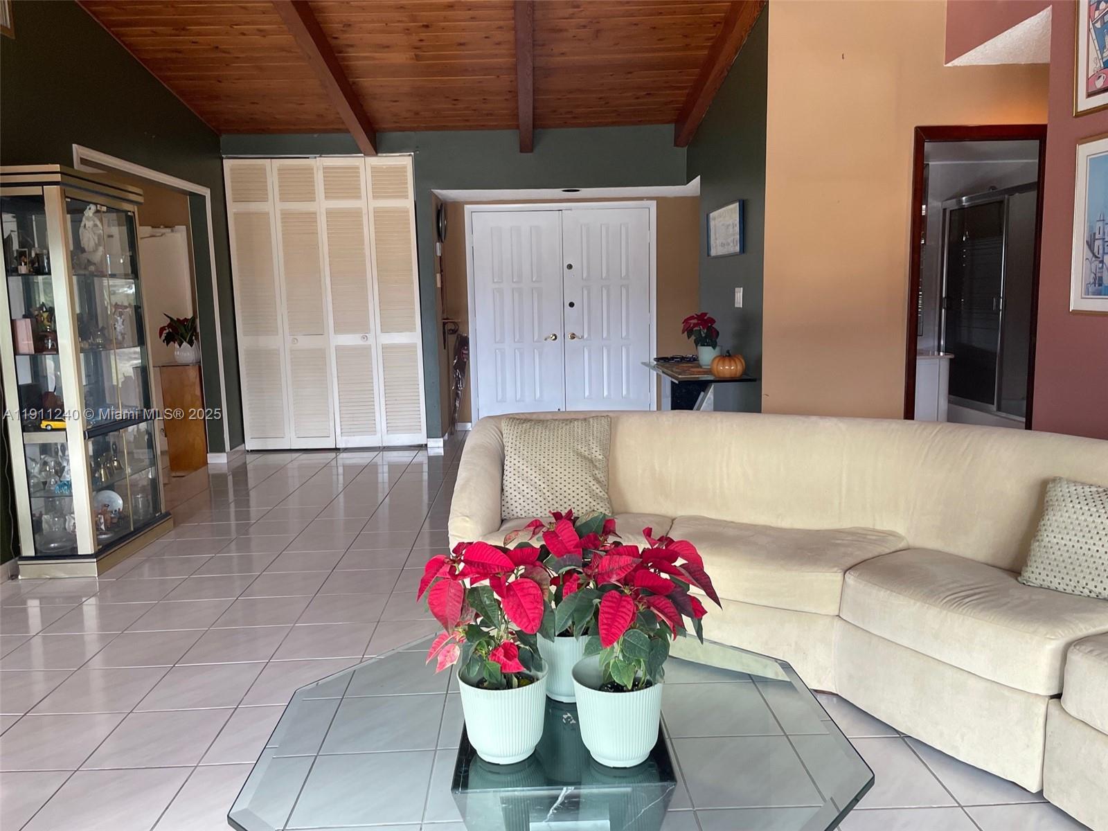 14604 Southwest 60th Terrace Miami, FL 33183 - Photo 41 of 55 a living room with furniture and flowers