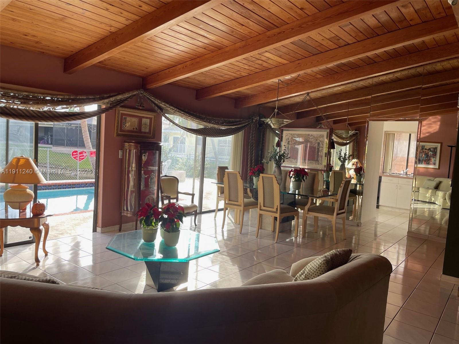 14604 Southwest 60th Terrace Miami, FL 33183 - Photo 51 of 55 a dining room with furniture floor to ceiling window and outdoor view