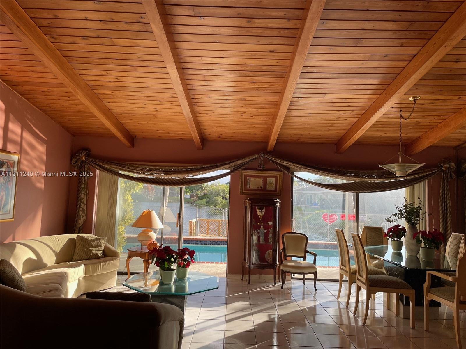 14604 Southwest 60th Terrace Miami, FL 33183 - Photo 52 of 55 a view of a patio with a table and chairs and a barbeque