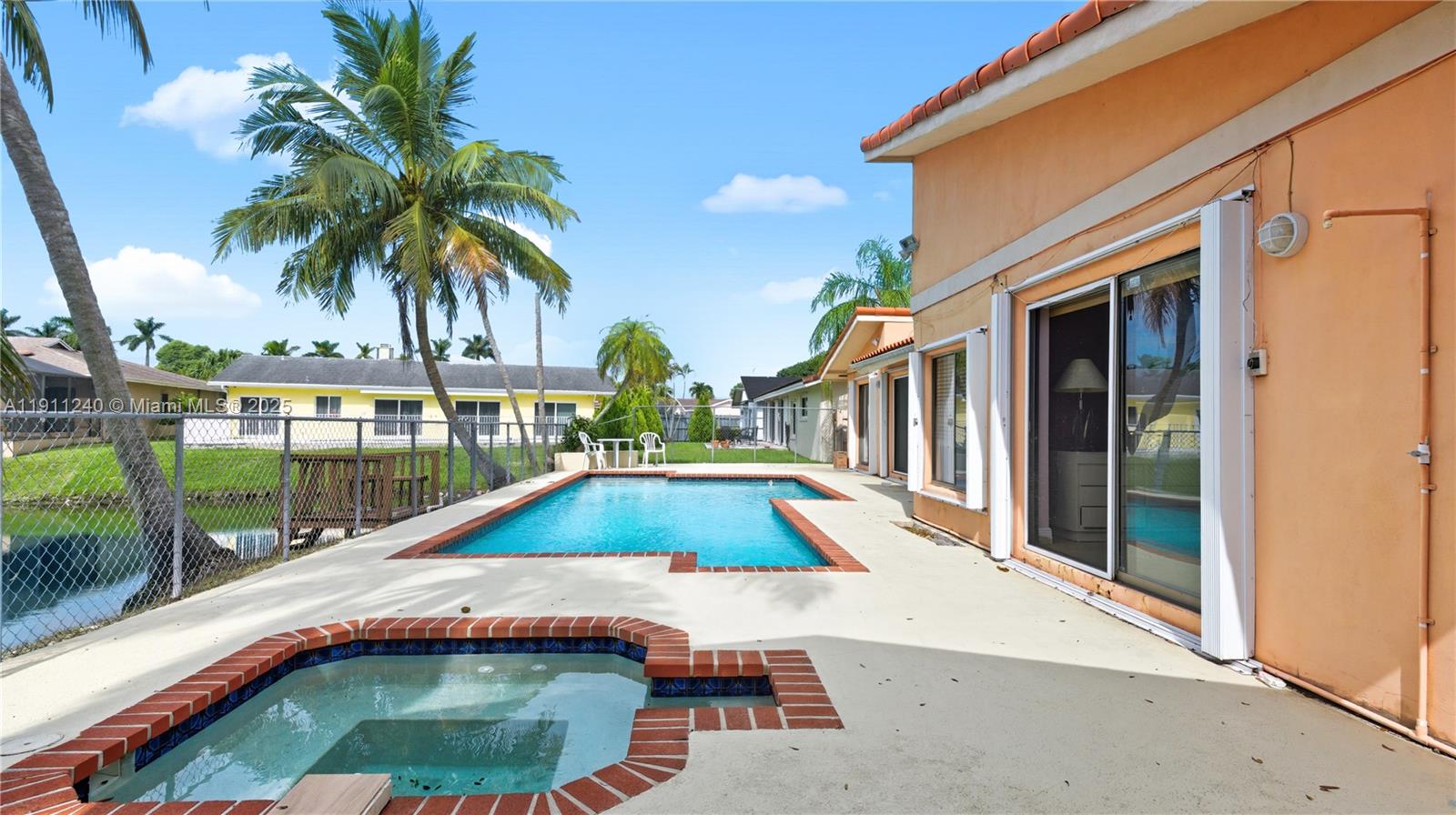 14604 Southwest 60th Terrace Miami, FL 33183 - Photo 6 of 55 a view of swimming pool with a patio and a garden