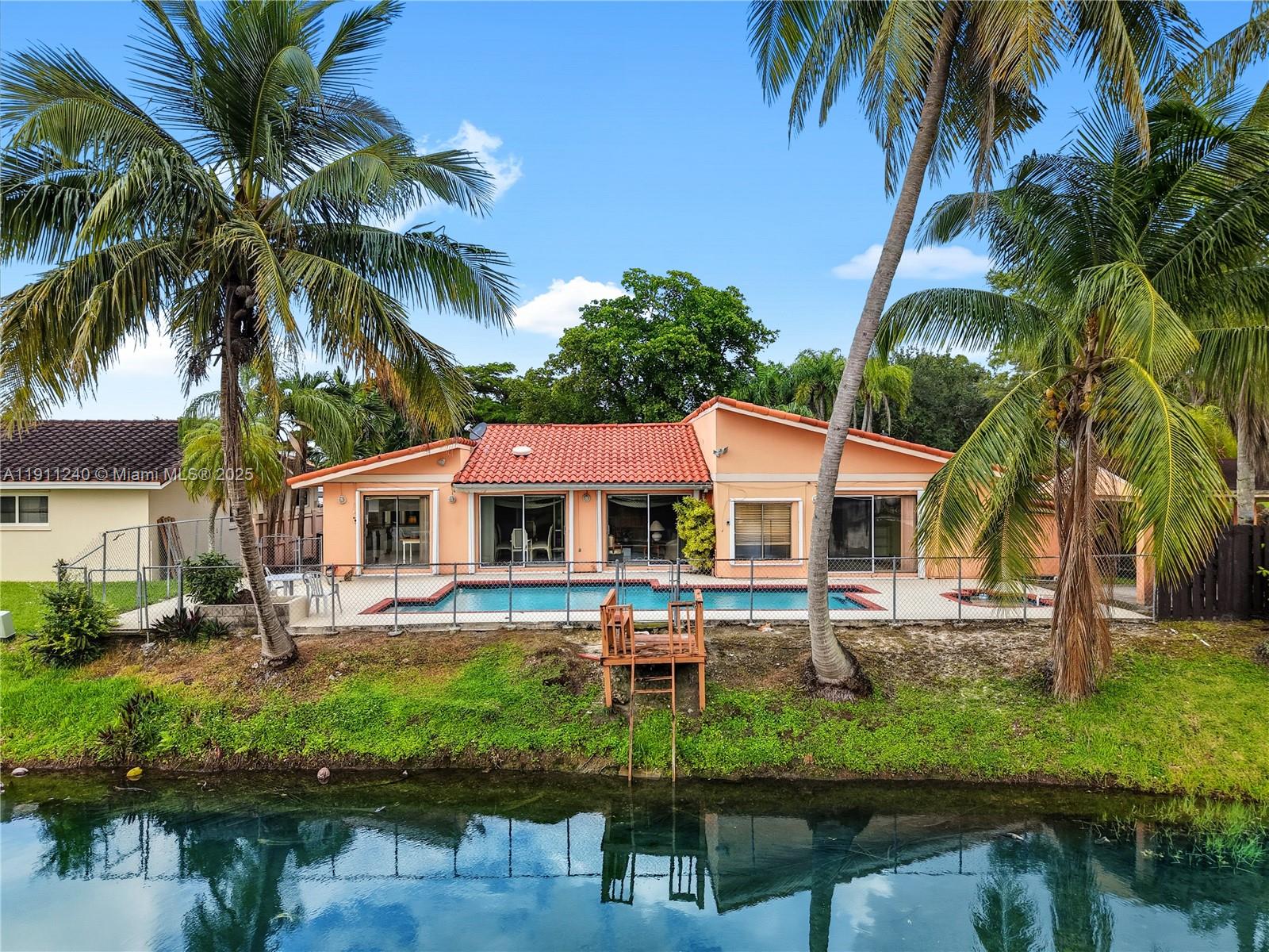 14604 Southwest 60th Terrace Miami, FL 33183 - Photo 7 of 55 a front view of house with yard and outdoor seating