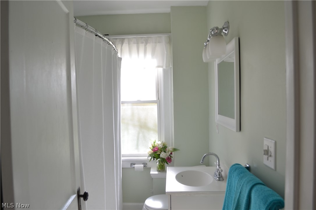 2125 Lorimer Road Cleveland, OH 44134 - Photo 18 of 18 Bright and sunny, updated full bath features original restored marble tile floor.