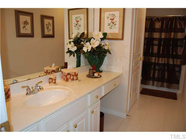 3733 Old Post Road Raleigh, NC 27612 - Photo 14 of 25 a bathroom with a sink and a mirror