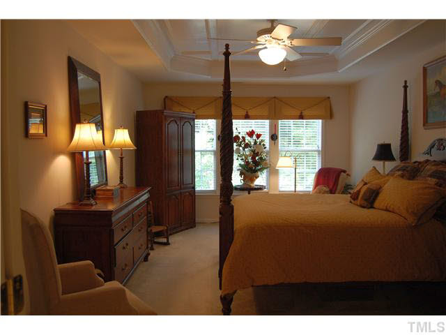 3733 Old Post Road Raleigh, NC 27612 - Photo 19 of 25 a bedroom with furniture and a chandelier