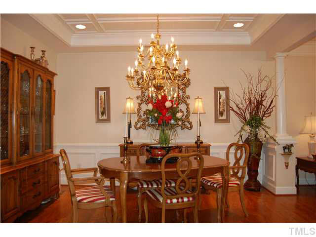 3733 Old Post Road Raleigh, NC 27612 - Photo 4 of 25 a view of a dining room with furniture and chandelier