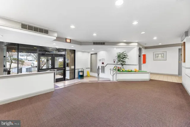 a kitchen with stainless steel appliances granite countertop a stove a refrigerator and a sink