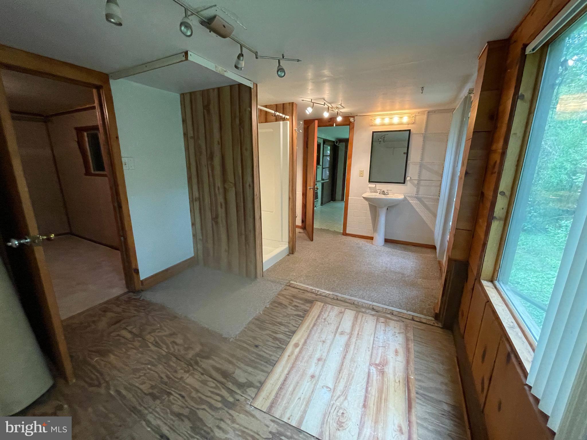 175 Howellsville Road Front Royal, VA 22630 - Photo 14 of 18 a view of a hallway with wooden floor and staircase