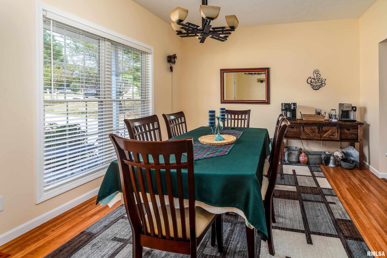 145 Oakview Road Carbondale, IL 62901 - Photo 13 of 42 a view of a dining room with furniture window and wooden floor