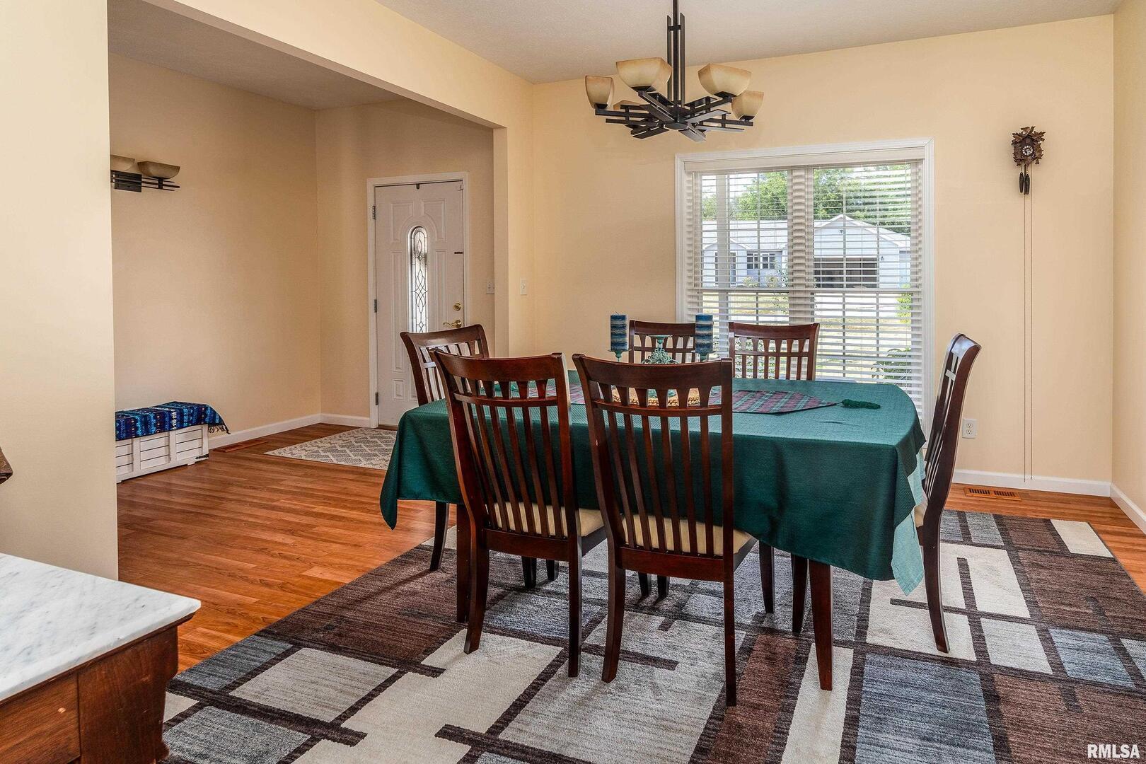 145 Oakview Road Carbondale, IL 62901 - Photo 15 of 42 a view of a dining room with furniture window and wooden floor