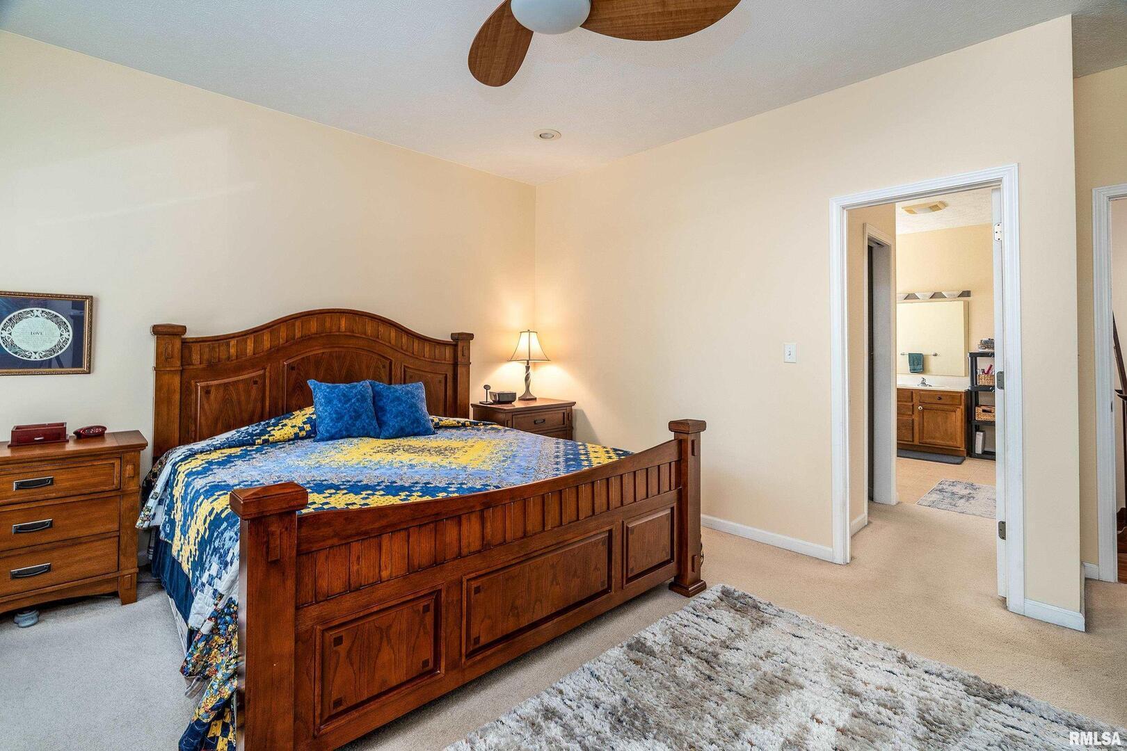 145 Oakview Road Carbondale, IL 62901 - Photo 17 of 42 a bedroom with a bed and wooden floor