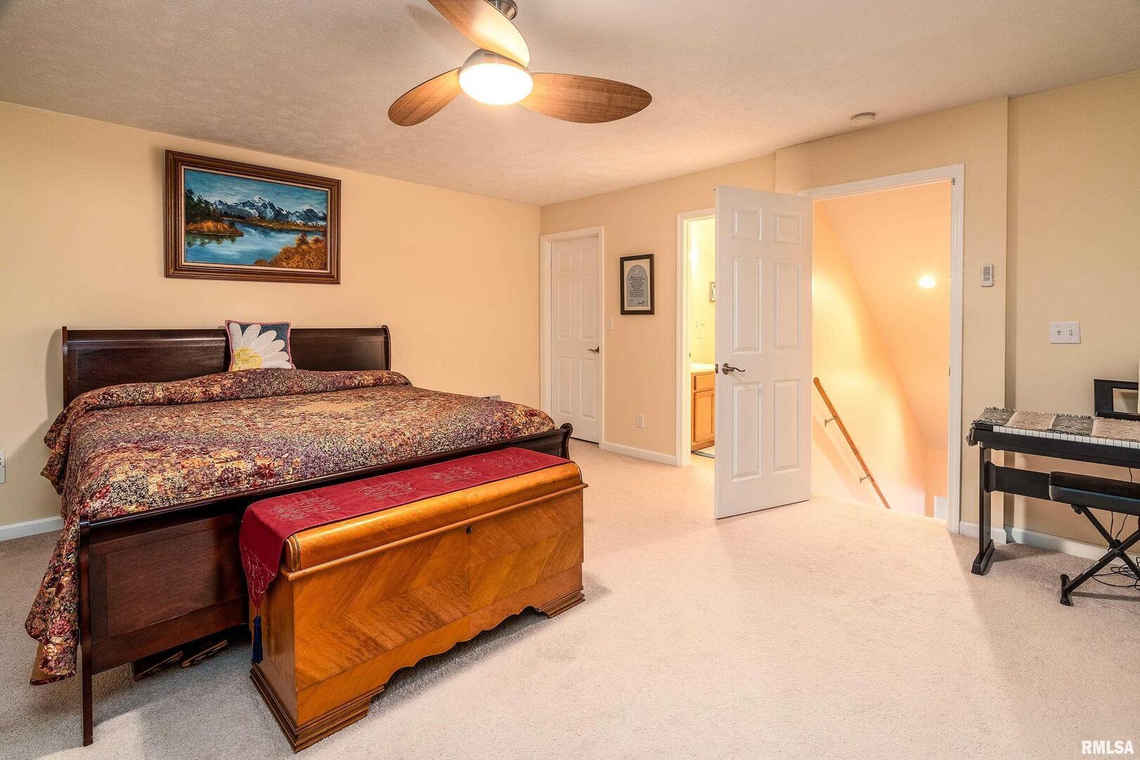 145 Oakview Road Carbondale, IL 62901 - Photo 28 of 42 a bedroom with a bed and a dresser next to a window